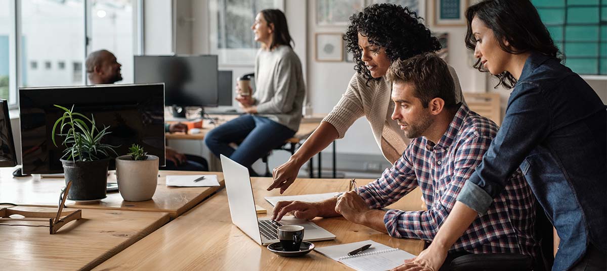 Image of developers collaborating at a computer