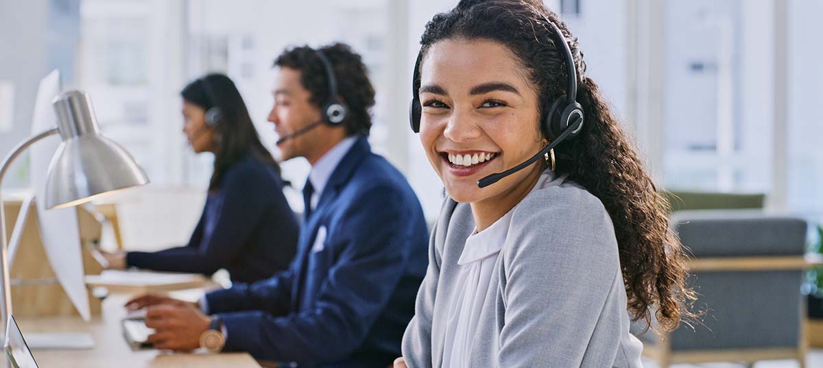 Image of customer service employees, happy at work