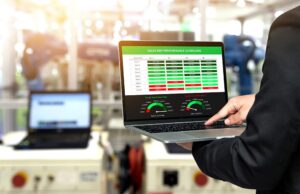 Person holding laptop with sales rep dashboard displayed